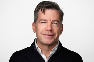 NG headshot, sweater, white background 